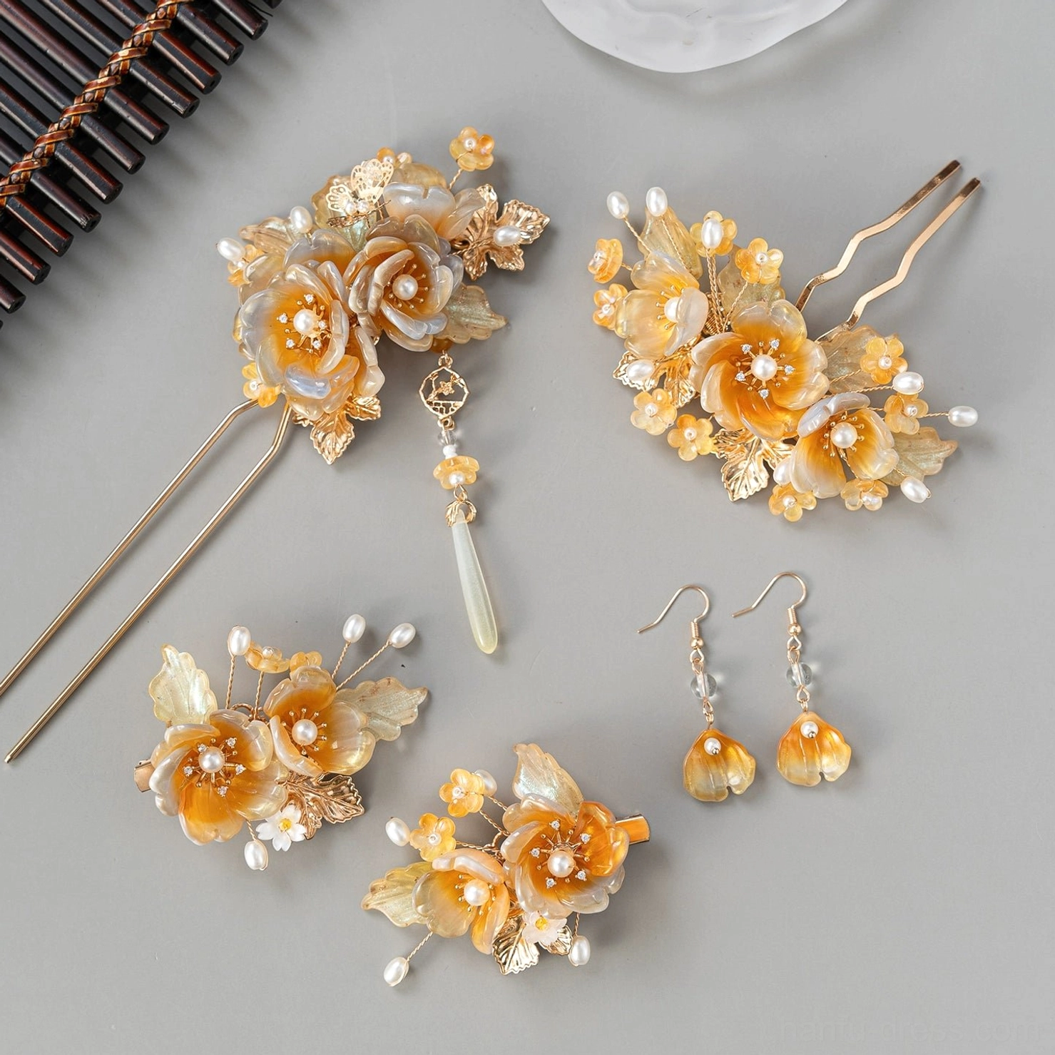 Full amber floral Hanfu hair accessory set with gold-tone hair ornaments, faux pearl details, pendant hairpins, and matching drop earrings arranged on a light background