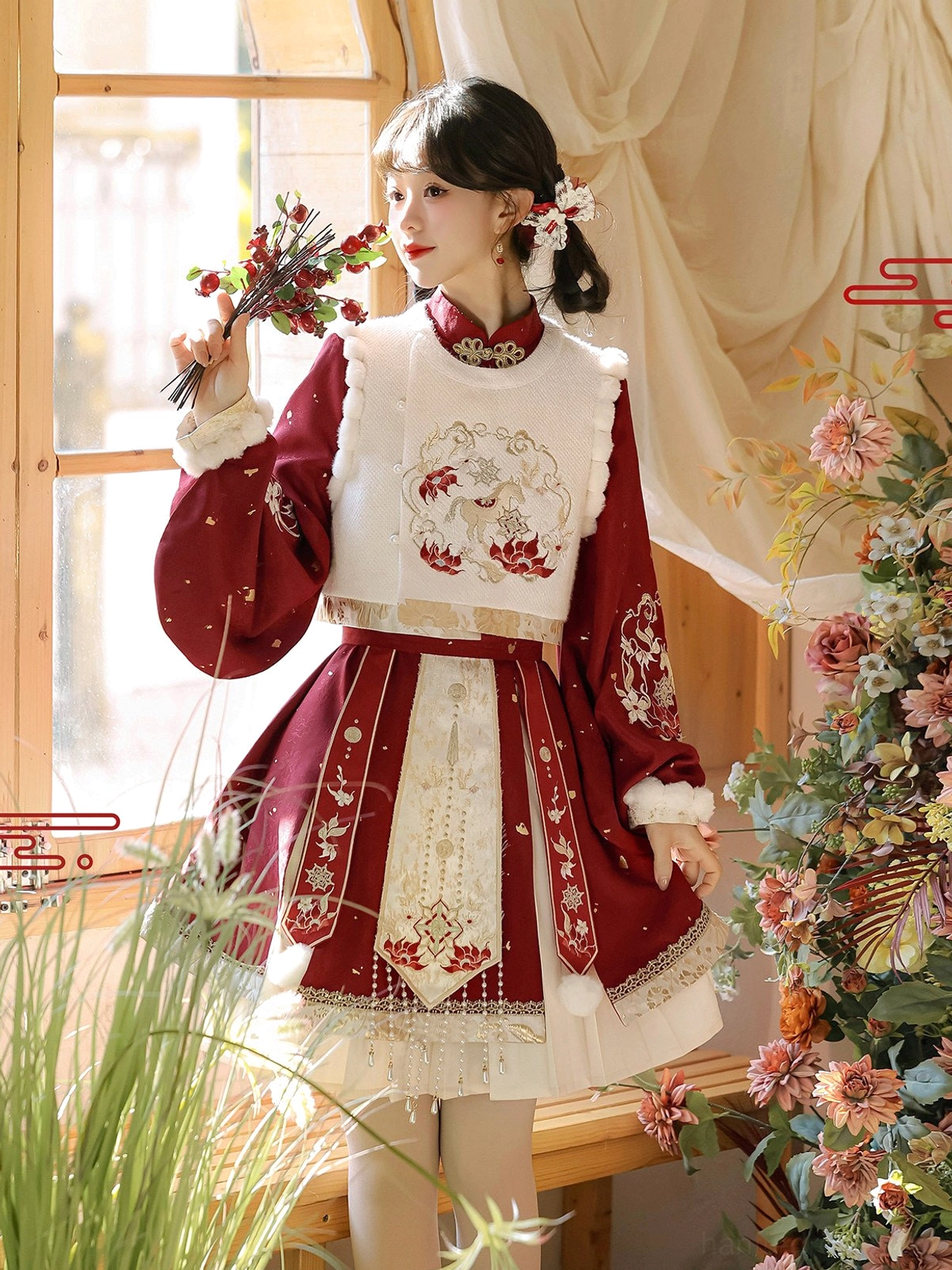Side view of wine red and ivory Ming inspired Hanfu Chinese New Year outfit showing embroidered vest, auspicious motif and tassel skirt details