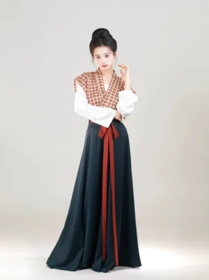 Three-quarter front view of a woman wearing the Garden After Rain Tang Dynasty Hanfu Beizi Qiyao Ruqun set with a red-brown grid-pattern vest, white long-sleeve inner top, dark teal flowing skirt, and red waist sash