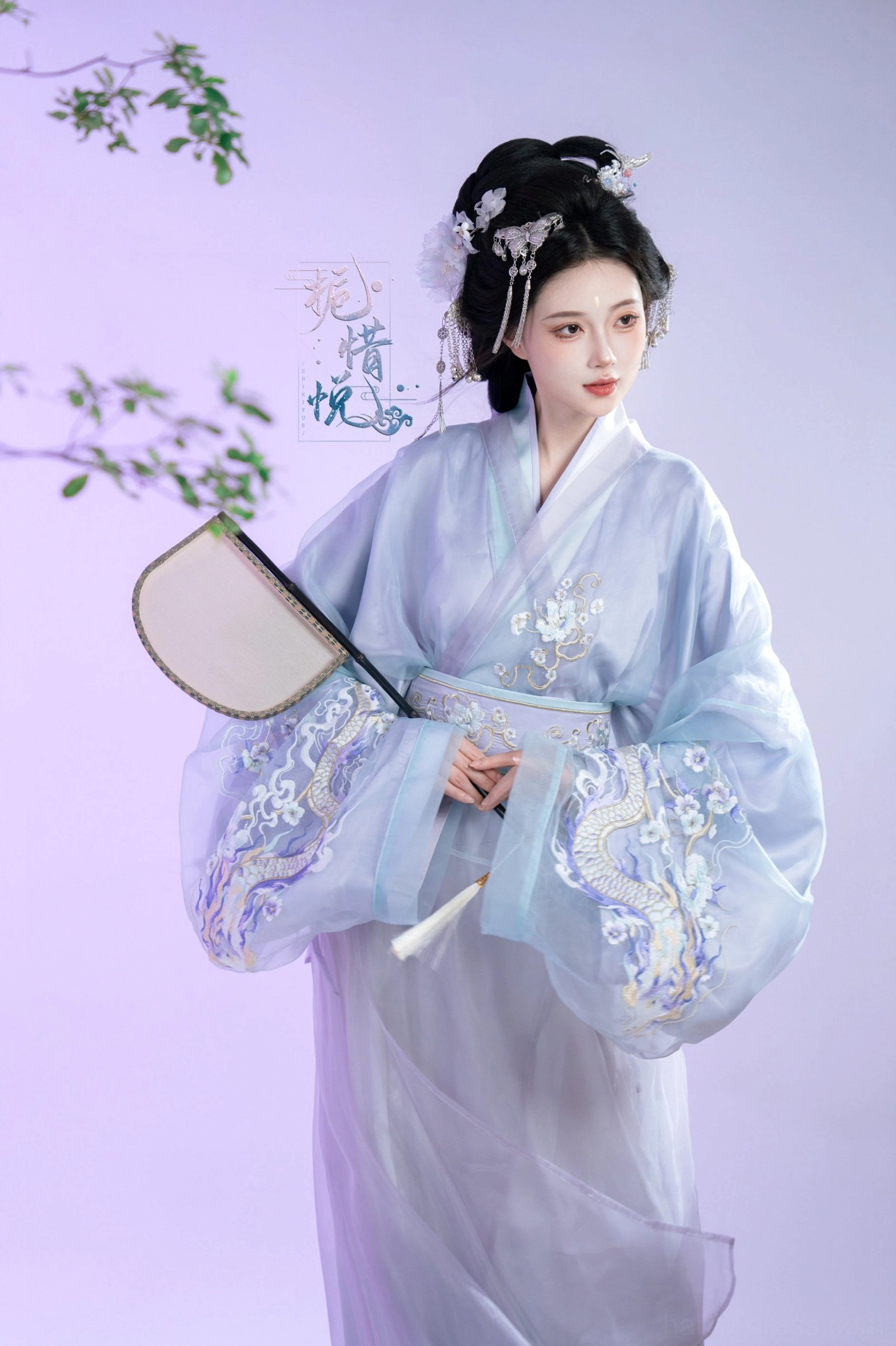 Close front view of Gardenia Han Dynasty Hanfu robe with dragon and floral inspired embroidery on wide sleeves, blue lavender layers, and matching belt