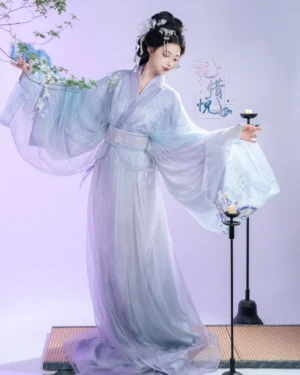Gardenia Han Dynasty Hanfu straight hem robe set in blue and lavender, full body left three quarter view showing flowing wide sleeves and embroidered sash