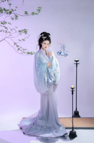 Front view of Gardenia Warring States inspired Han Dynasty Hanfu with light blue cross collar robe, lavender skirt, embroidery, and floor length hem