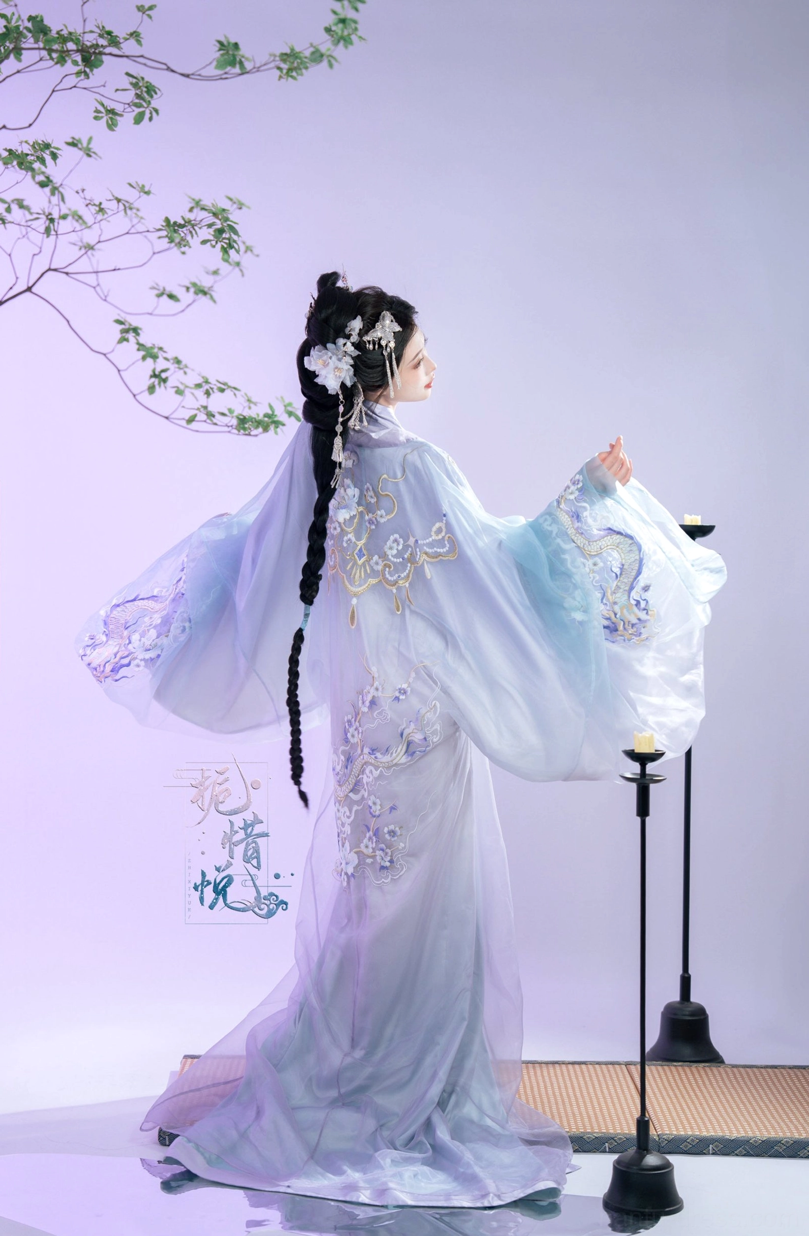 Back view of Gardenia Han Dynasty Hanfu straight hem robe showing gradient lavender train, wide sleeves, and embroidered back details