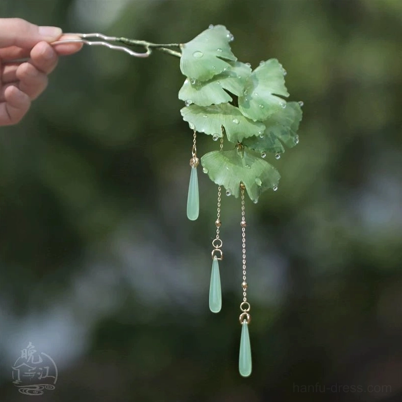 Full view of ginkgo leaf Chinese hair stick featuring translucent dew drops and three jade-tone tassel pendants