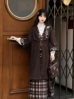 Side view of Ginkgo Notes modern Hanfu outfit showing floral embroidered brown coat and fitted plaid dress silhouette