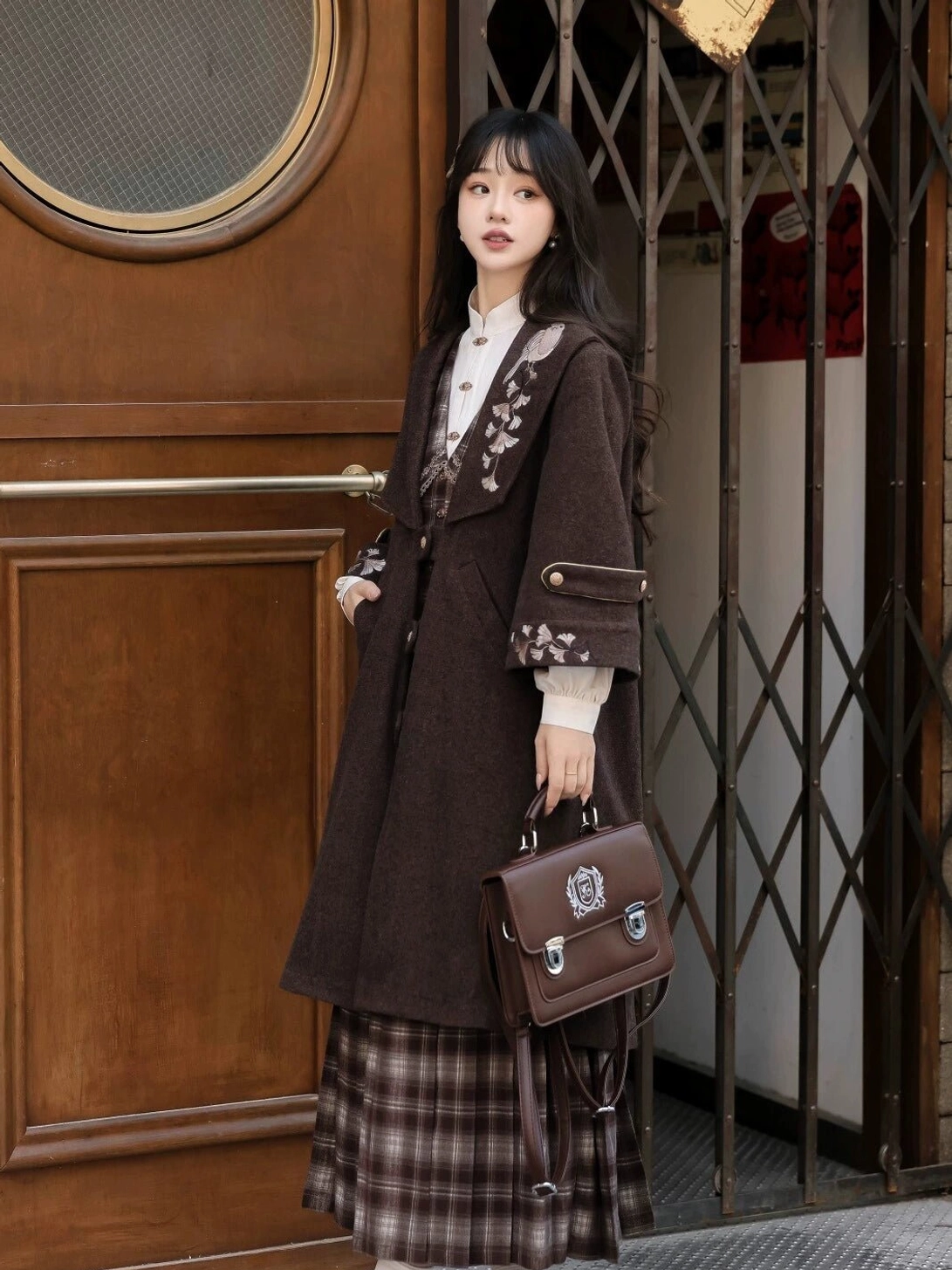Vintage Chinese-inspired modern Hanfu three-piece outfit with embroidered cuff details and brown plaid skirt