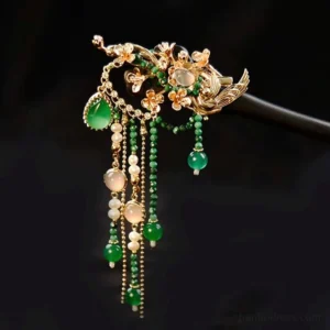 Gliding Peacock Chinese hair stick with gold-tone floral bird ornament green agate accents and flowing beaded tassels on black background