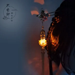 Glowing lantern Chinese hair stick with dark metal crane ornament, purple floral beads, golden lantern pendant, and long tassel worn in a braided Hanfu hairstyle