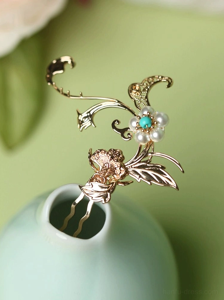 Detailed side view of a vintage Chinese hair pin featuring a gold carved flower and leaf motif with imitation pearl and turquoise floral bead decoration on a cyan porcelain vase