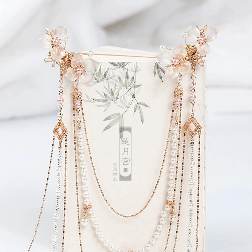 Gold-tone white hibiscus back hair pin set for Hanfu hairstyle styling, shown with layered pearl tassels and geometric Chinese-inspired ornaments