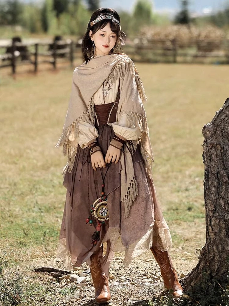 Three-quarter side view of a modern Hanfu outfit with embroidered cuffs, faded brown tie-dye suspender skirt, fringed shawl, vintage ethnic bag, wooden bracelets, and traditional-inspired headwear outdoors
