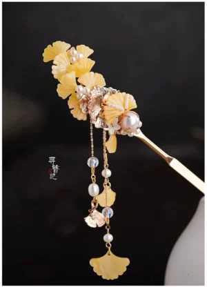 Golden ginkgo leaf tassel hairpin with rose gold tone metal, yellow resin leaves, faux pearls, and layered beaded pendants for Hanfu hairstyles