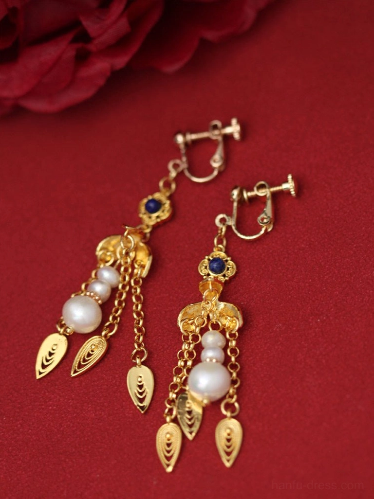 Piercing-free comfort clip-on golden gourd Chinese earrings with pearl tassels, blue accents, and gold leaf pendants on red fabric