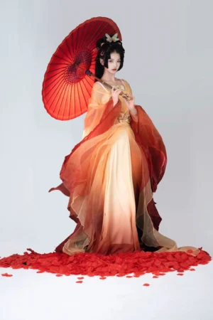 Golden Lotus Wei Jin Dynasty Hanfu full set with flowing yellow and red gradient skirt, sheer sleeves, golden decorations, traditional hairstyle, and red Chinese oil-paper umbrella