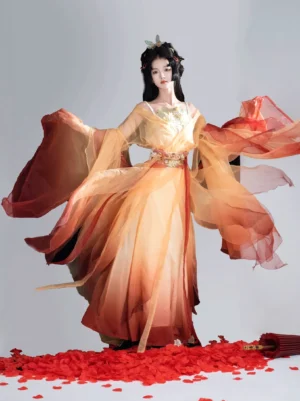 Full-body front view of a woman wearing Golden Lotus Wei Jin Dynasty Qiyao Ruqun Hanfu with yellow to deep red ombre fabric, sheer wide sleeves, golden chest ornament, waist belt, and flowing skirt