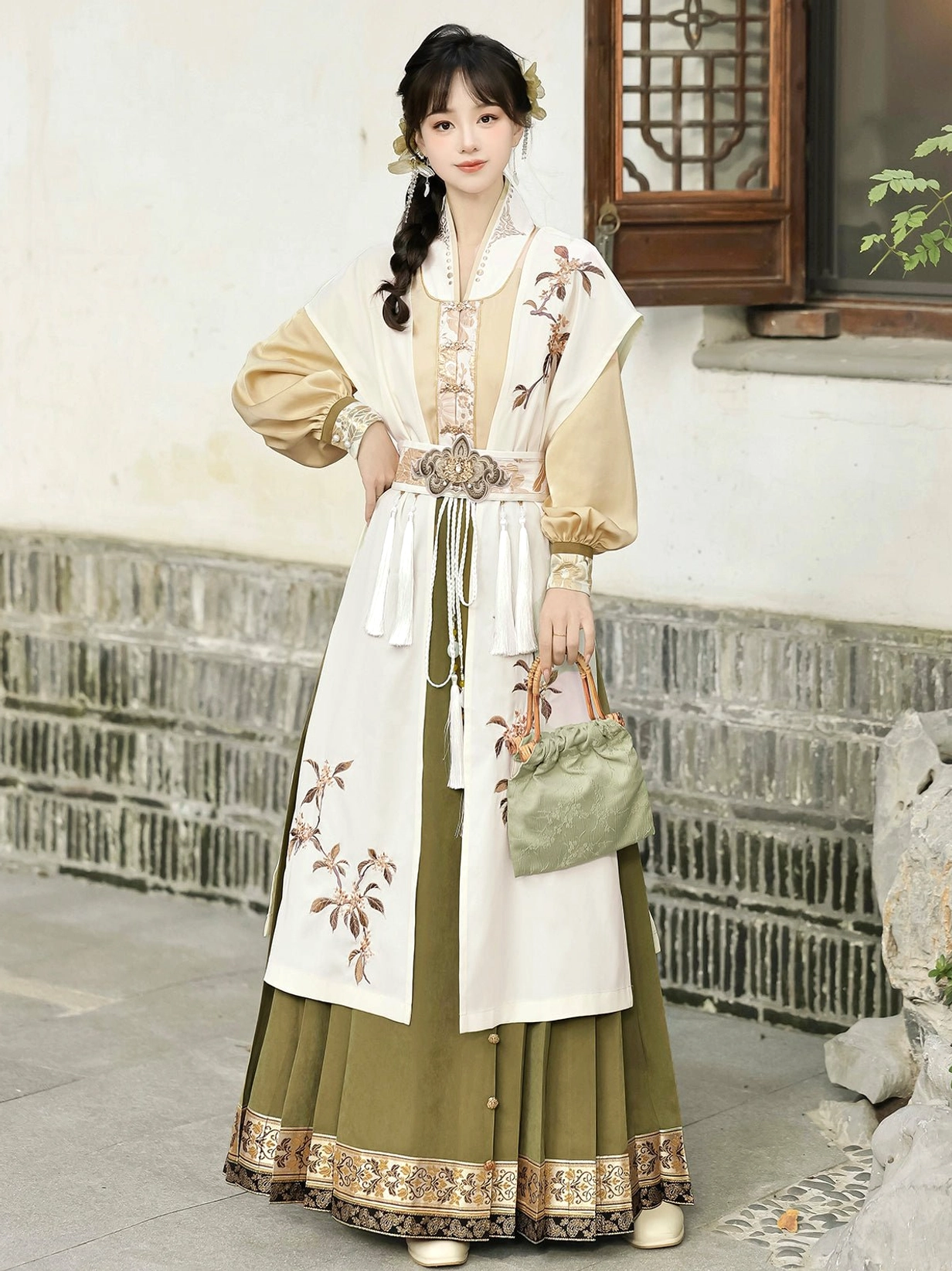 Modern Ming Hanfu outfit with golden osmanthus embroidered cream layer and olive green mamianqun skirt styled with a light green handbag