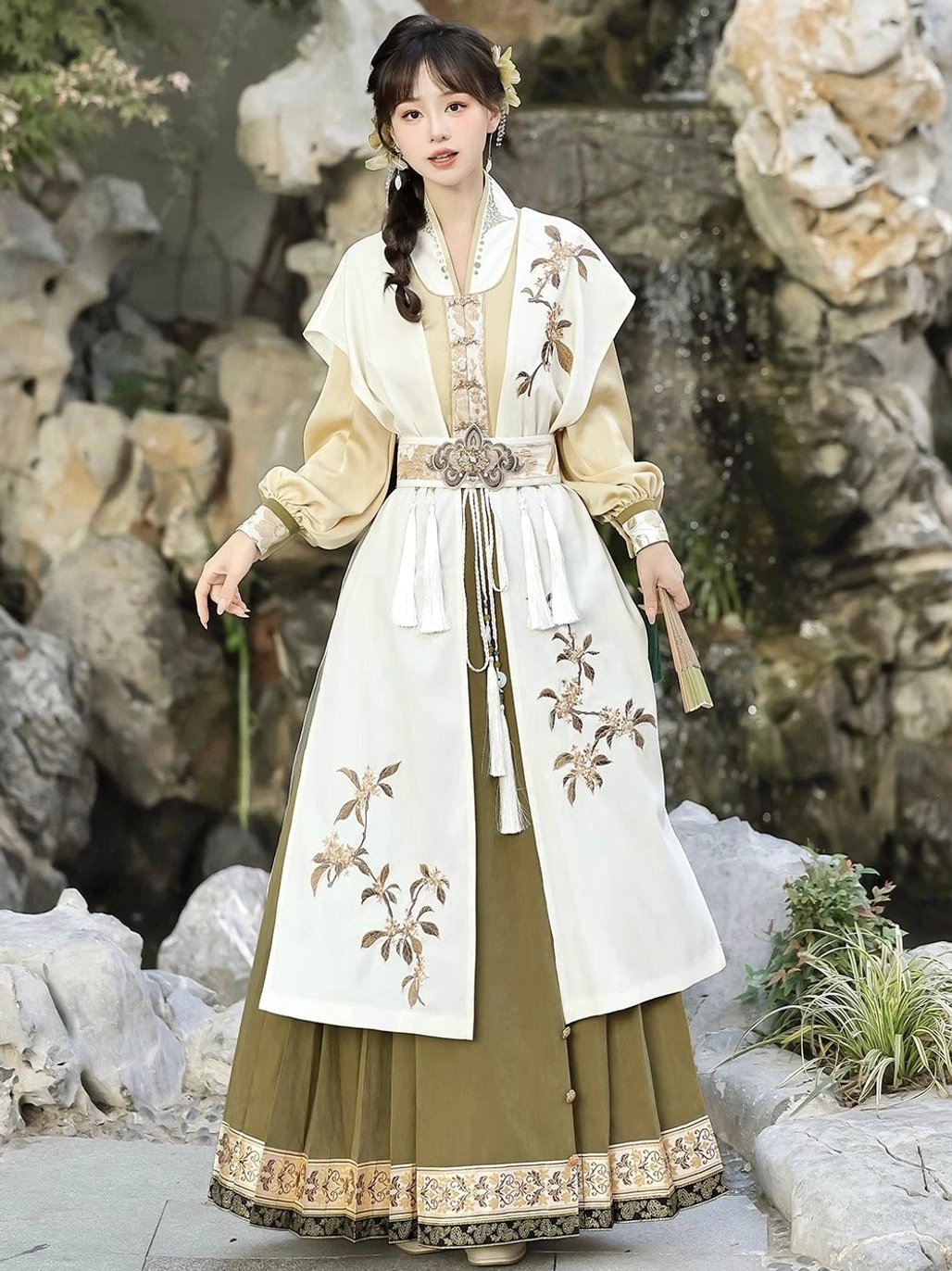 Three-quarter view of golden osmanthus Ming style Hanfu outfit with embroidered cream outer layer and olive green pleated mamianqun skirt
