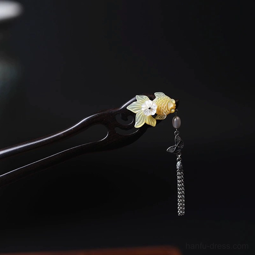 Golden Scales Chinese hair stick with dark double-pronged base, golden fish, white flower, butterfly charm and long tassel for Hanfu hairstyles