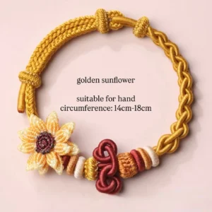 Golden sunflower handwoven Chinese knot bracelet with braided cords, wine red knot detail and colorful spacer beads on a light pink background