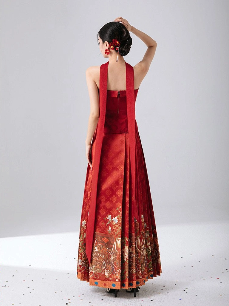 Back view of Golden Treasure red Chinese New Year bustier showing back zipper closure, long red neck sash, and styled pleated mamian skirt