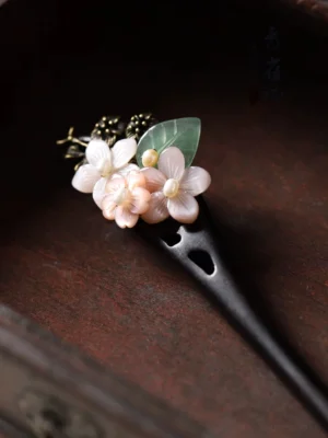 Good Year floral Chinese hair stick with pink white shell flowers green jade-like leaf antique bronze ornament and dark carved wooden pin