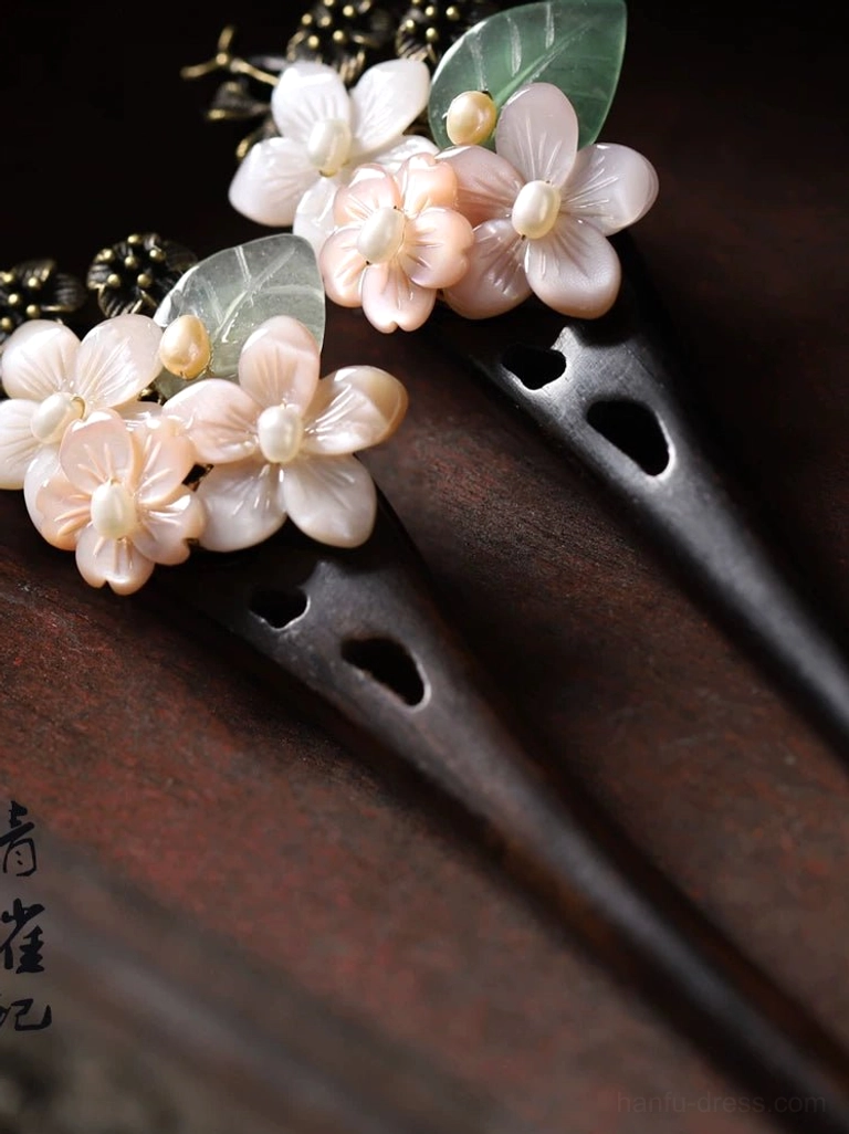 Collection of Good Year floral Hanfu hair sticks featuring pink white flowers green leaf accents antique bronze details and dark wooden pins