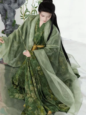 Three-quarter side view of a green Song Dynasty Hanfu bamboo leaf print outfit showing the sheer flowing outer beizi, cross-collar robe, golden waist belt, and traditional styling