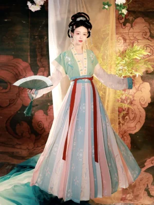 Green Tang Dynasty Hanfu beizi qiyao ruqun outfit with pastel striped pleated skirt, red waist belt, traditional hairstyle, and green folding fan