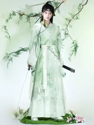 Front full-body view of green Xianxia wide-sleeve Hanfu set with ink-wash gradient robe, white sleeve panels, tassel sash, and traditional sword styling