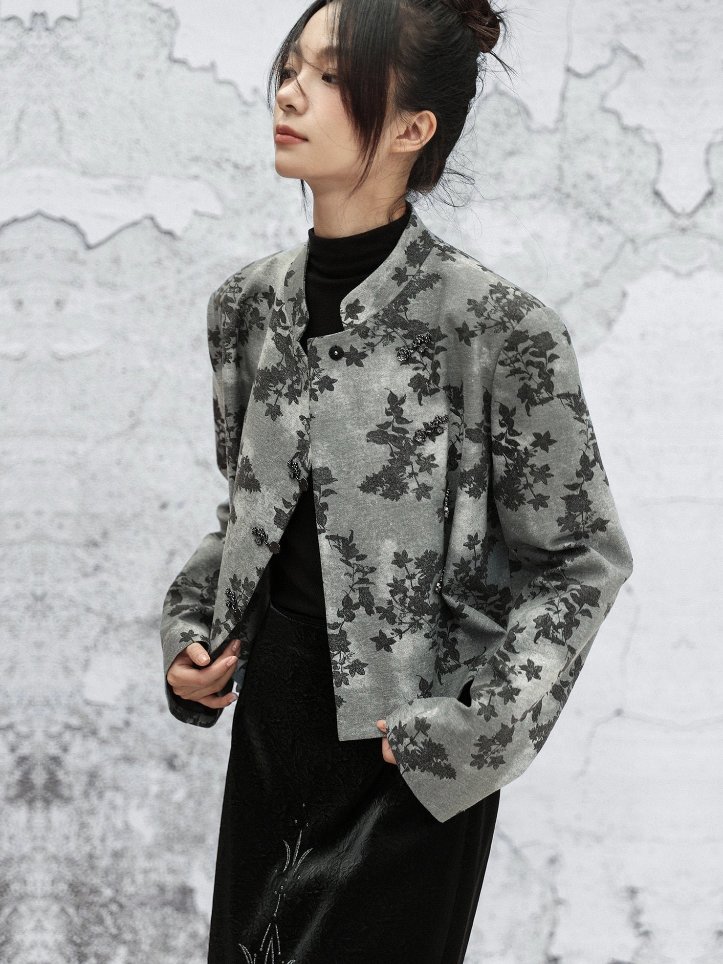Side upper-body view showing stand collar and single-breasted closure on grey floral print Modern Hanfu cropped jacket