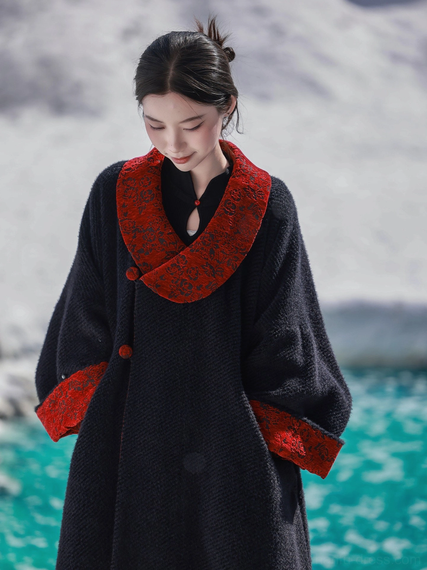 Close-up of Gryffindor-inspired modern Tang Dynasty Hanfu coat showing plush black chenille fabric, red jacquard collar, cuffs, and buttons