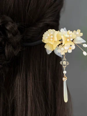 Traditional Chinese hair stick worn in a braided bun hairstyle, showing the Haitang floral Hanfu hair accessory and dangling tassel