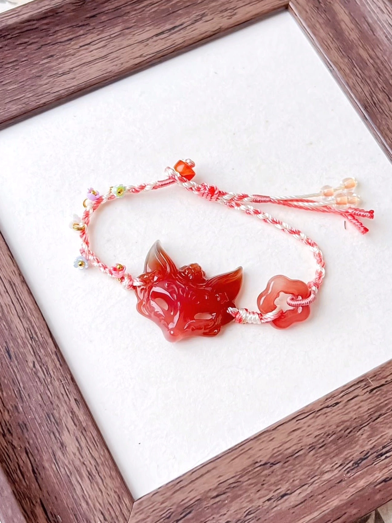 Hand-braided agate fox spirit Chinese bracelet with red and white cord, tiny colorful decorations, fox pendant, cloud-shaped charm, and tassel rope ends