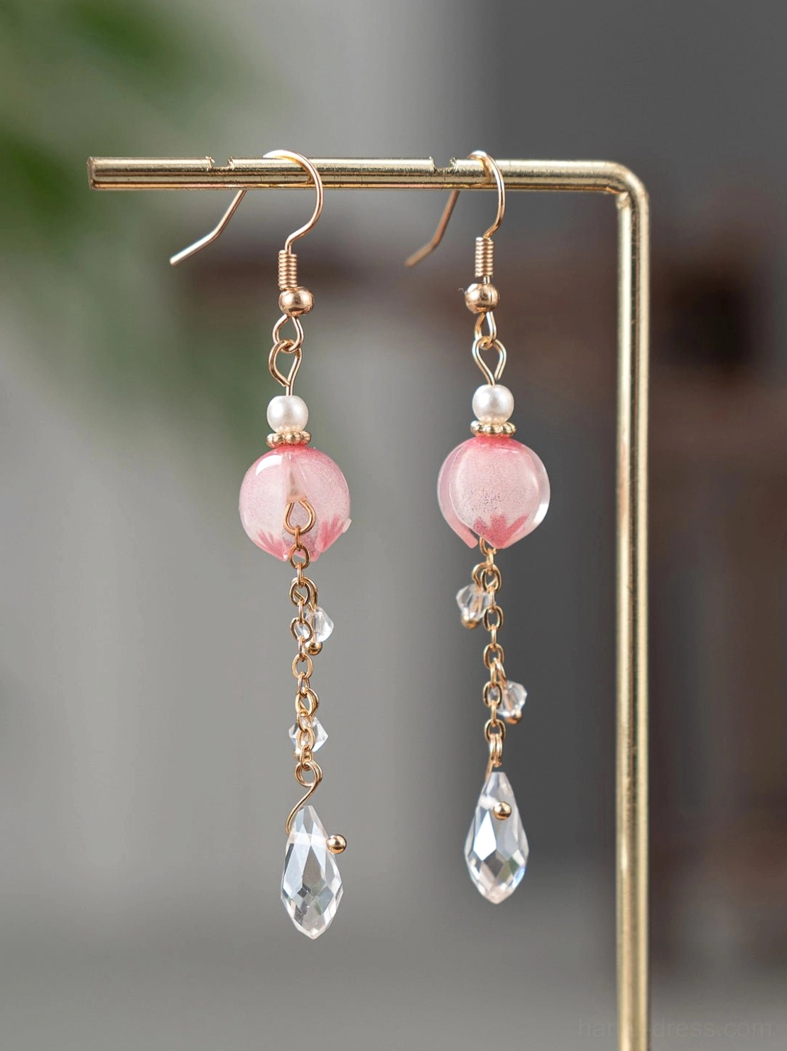 Pair of Hanfu dangle earrings with gold-tone hooks, white pearl tops, round pink glass beads, and clear teardrop crystal pendants