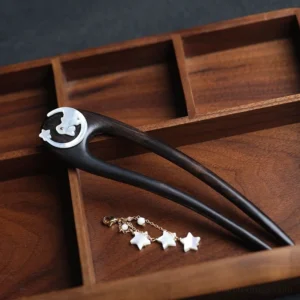 Hanfu double-pronged Chinese hair stick displayed with detachable golden chain tassel, moon motif, star inlay, and wooden storage tray