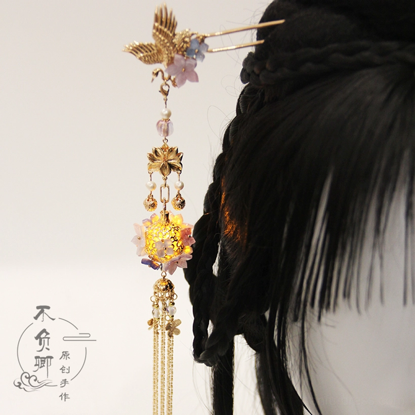 Hanfu-inspired glowing lantern hairpin with crane-shaped topper, purple floral decorations, gold chain tassel, and elegant ancient Chinese design