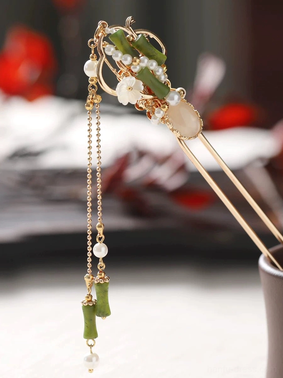 Side view of a Hanfu matching tassel hairpin with bamboo decorations, white shell-style flowers, pearl accents, gold-tone framework, and long bamboo and pearl pendant tassel