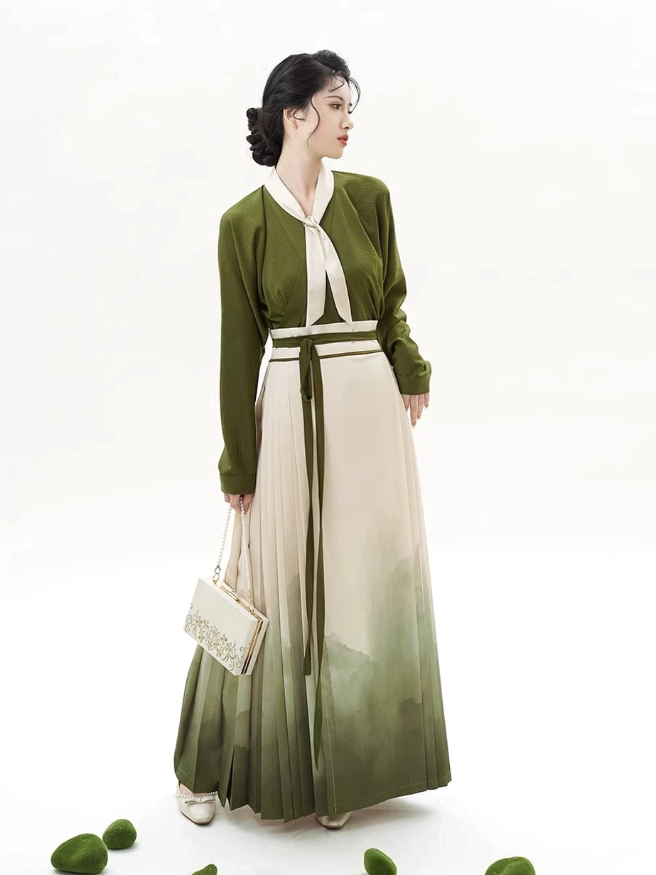 Rear side view of the pleated landscape mamian skirt and long-sleeved olive green blouse styled as a traditional Chinese outfit