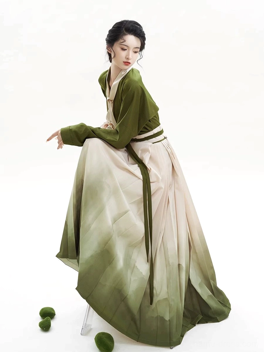 Side view of a flowing Chinese Hanfu outfit showing the gradient mountain-print mamian skirt and long green waist ties
