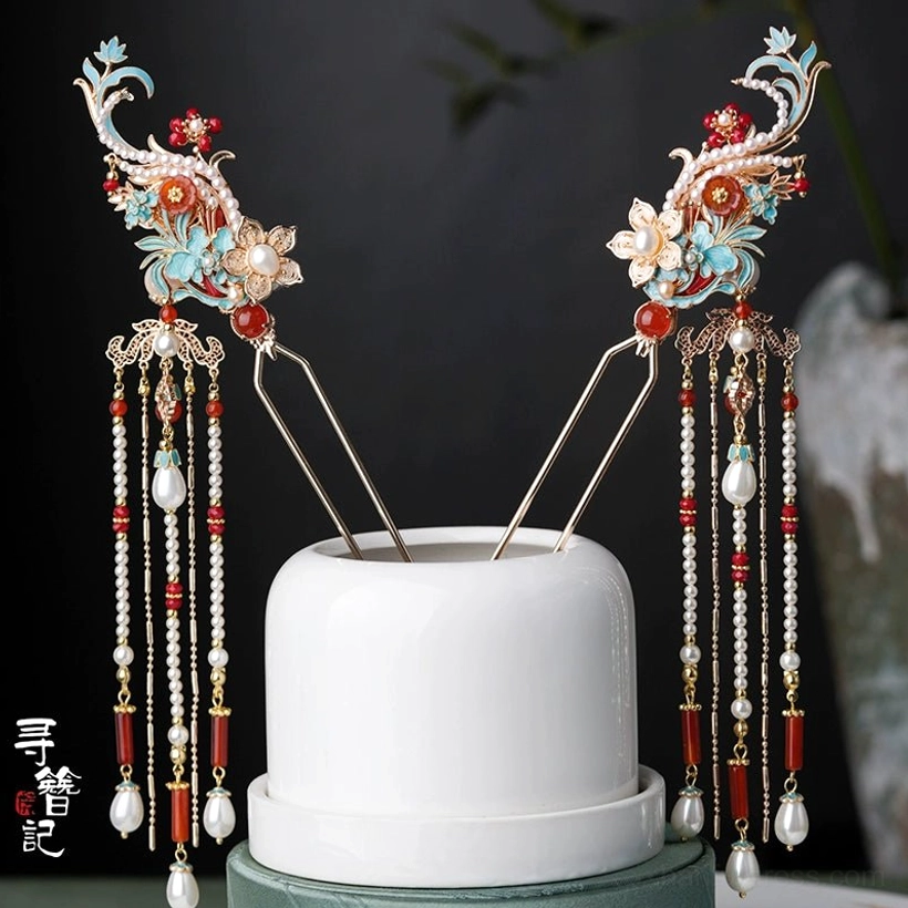 Pair of traditional Chinese hanfu tassel hairpins with phoenix-inspired turquoise ornaments, red beads, white flower details, long double tassels, and pearl-style drop pendants