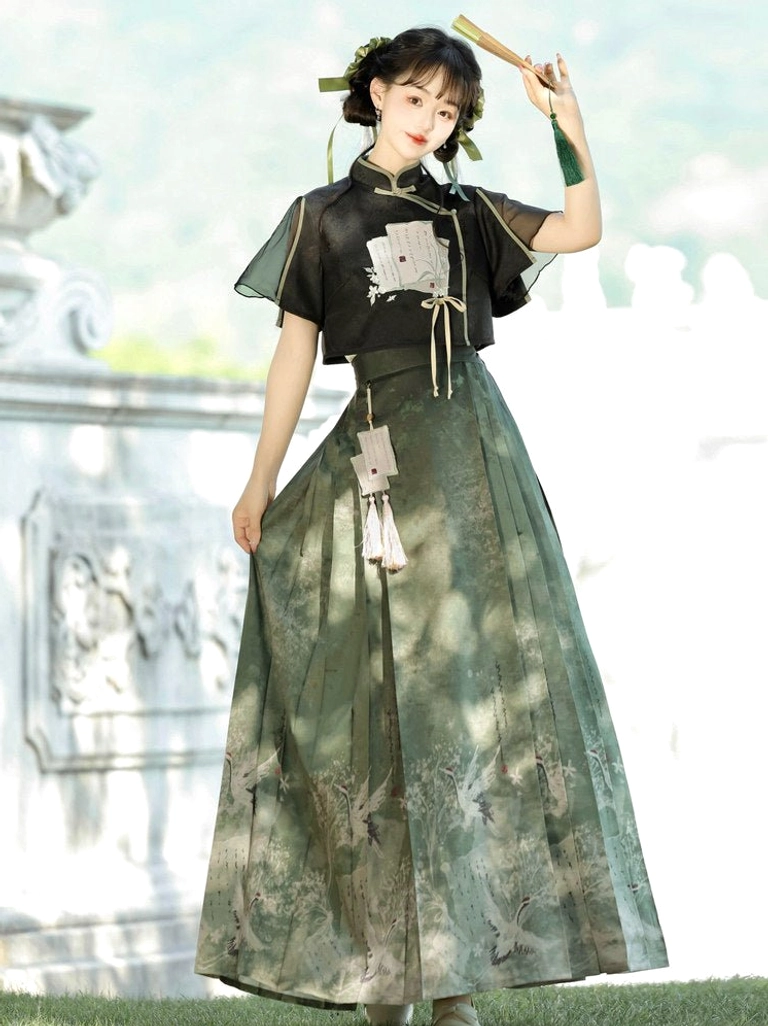 Modern Ming Dynasty Hanfu crop top and dark green mamianqun horse-face skirt worn in a classical Chinese garden with tassel pendants
