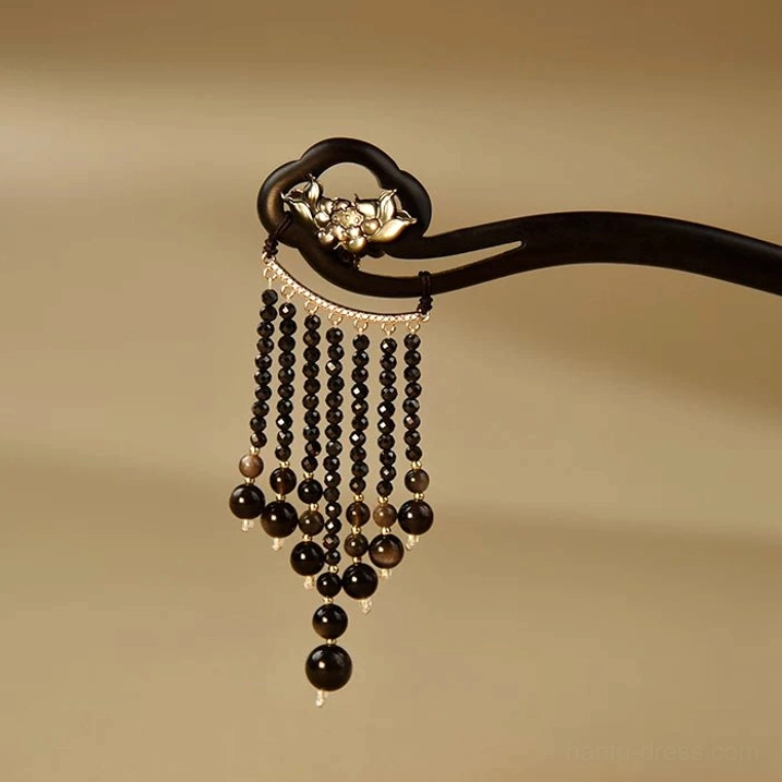 Front view of Huarong traditional Chinese ebony hair stick with silver lotus decoration and black bead tassels