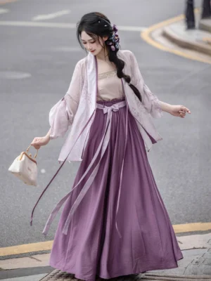 Ice Wisteria Song Dynasty modern Hanfu set styled on a city street with a sheer purple floral cardigan, nude camisole, deep purple long skirt, and beige handbag