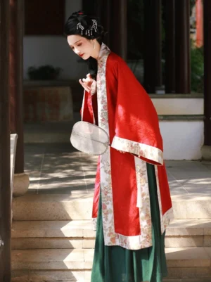 Song Dynasty Hanfu outfit in a Chinese garden pavilion featuring a wine red floral trim beizi and deep green pleated skirt