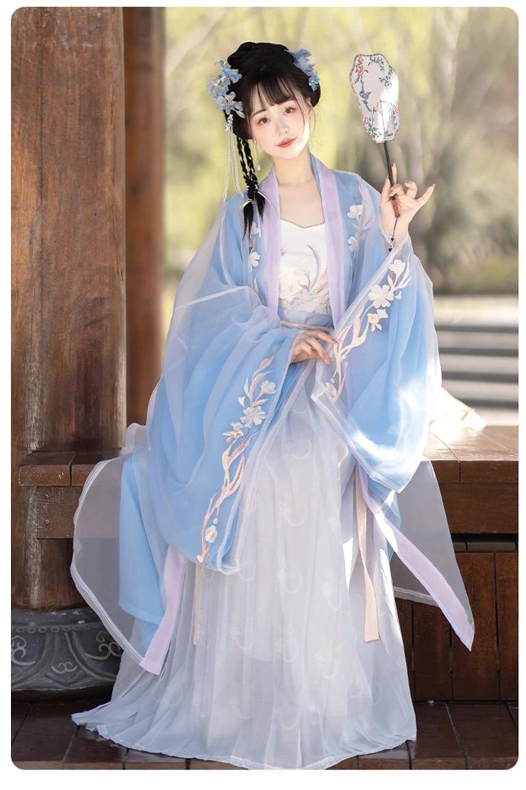 Indigo Blossoms Qiyao Ruqun Hanfu front left view with pink waist sashes, delicate floral sleeve embroidery, and traditional silhouette