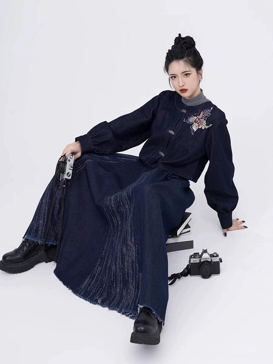Seated front view of indigo denim Hanfu two-piece set with cropped round-collar jacket and flowing eight-panel skirt