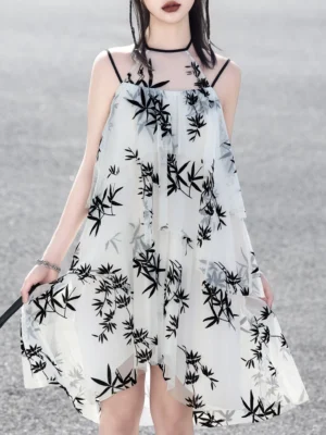 Front view of off white ink bamboo print modern Hanfu sundress with black halter straps and asymmetric layered hem