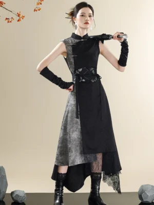 Front full-body view of a black and marbled gray ink-wash modern Hanfu dress with Mandarin collar, frog buttons, sleeveless silhouette, asymmetric lace-trimmed hem, and embroidered waist girdle
