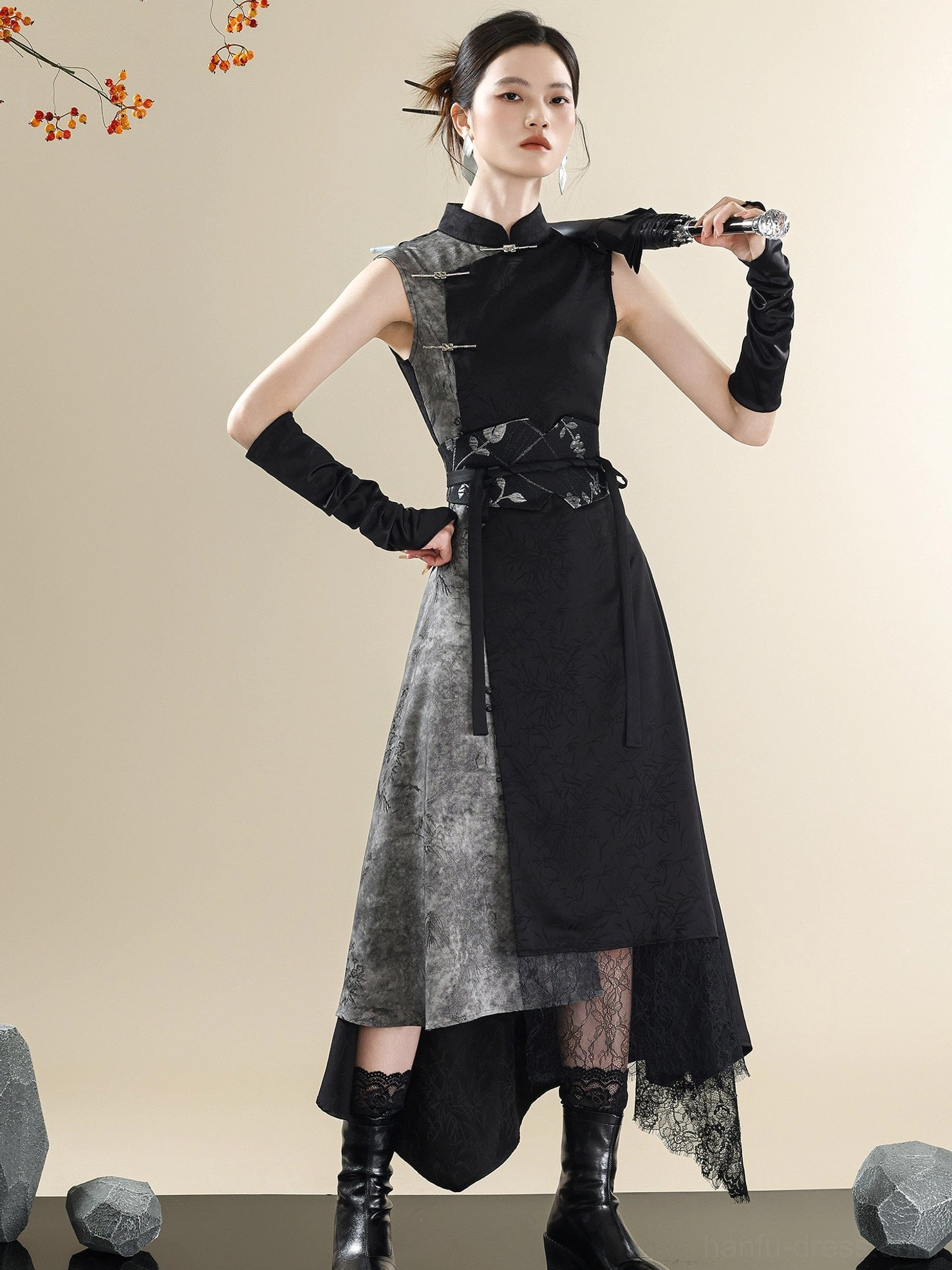 Front full-body view of a black and marbled gray ink-wash modern Hanfu dress with Mandarin collar, frog buttons, sleeveless silhouette, asymmetric lace-trimmed hem, and embroidered waist girdle
