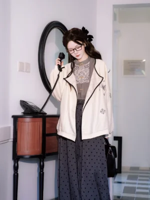Ink wash modern Hanfu Tang-inspired ivory round collar cardigan layered over dark gray top and black polka dot bloomers front view